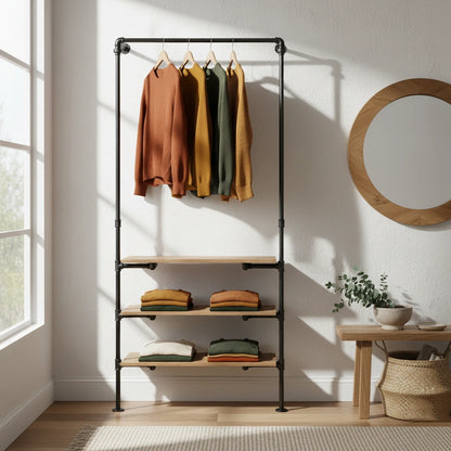 urb.style Frida wandmontierte Kleiderstange mit Regalen im Wohnzimmer/ Schlafzimmer behangen mit Kleidung und Deko im Raum.