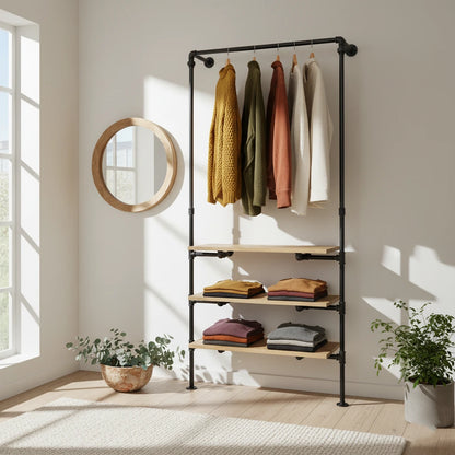 urb.style Frida wandmontierte Kleiderstange mit Regalen im Wohnzimmer/ Schlafzimmer behangen mit Kleidung und Deko im Raum.